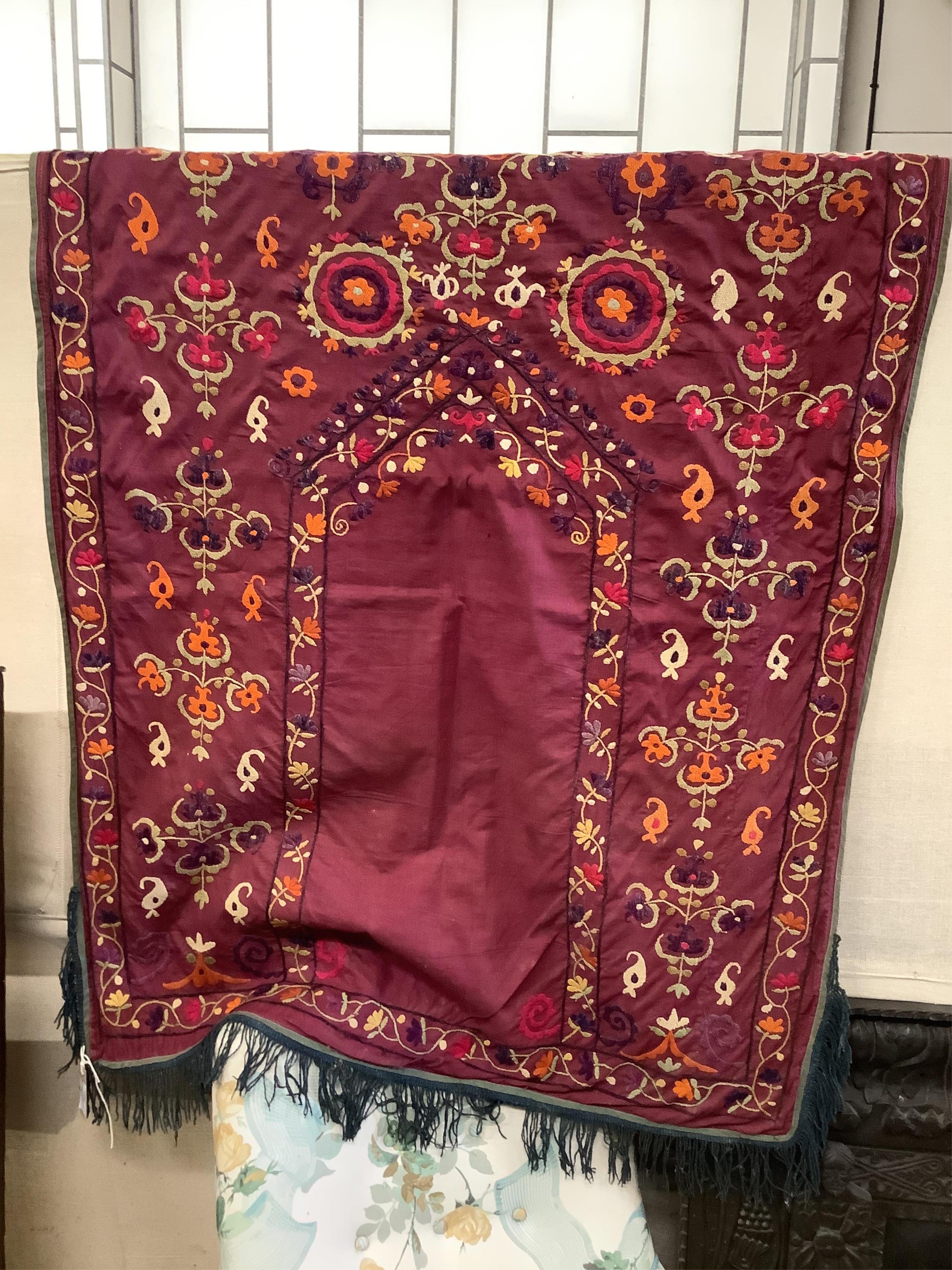 An early 20th century silk embroidered Uzbek Suzani, 120 x 92cm. Condition - fair